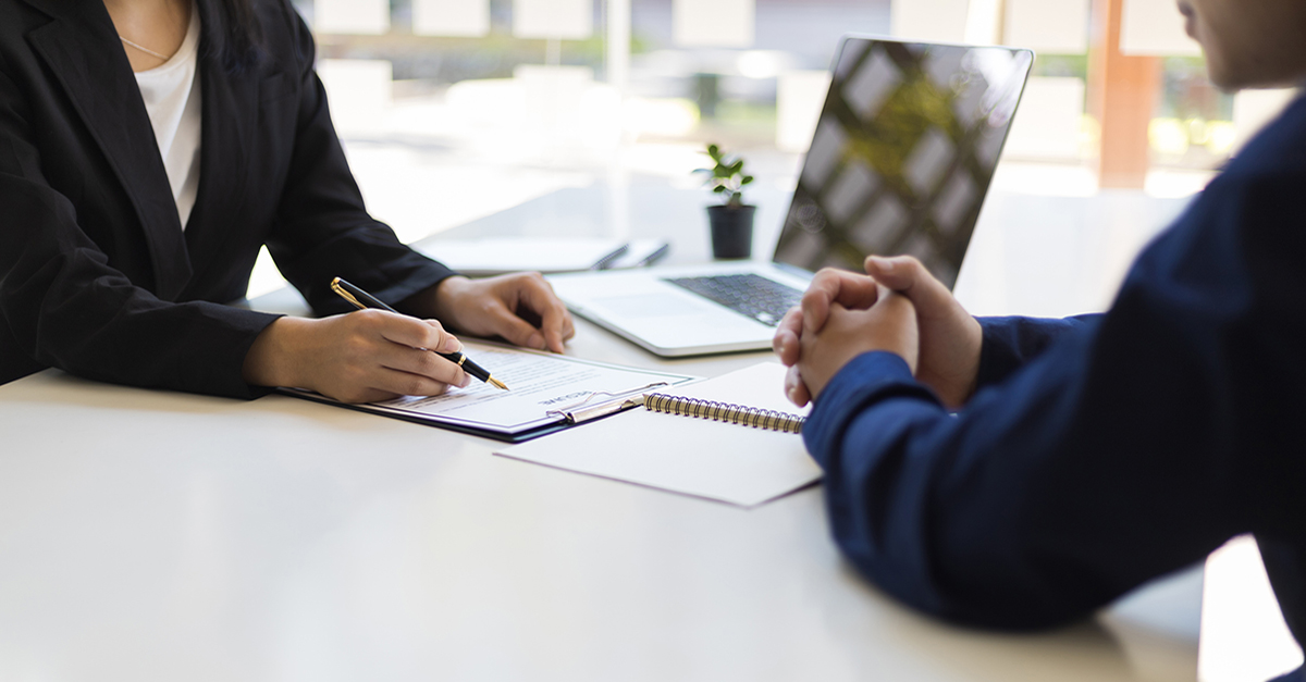 A client getting ready to sign documents