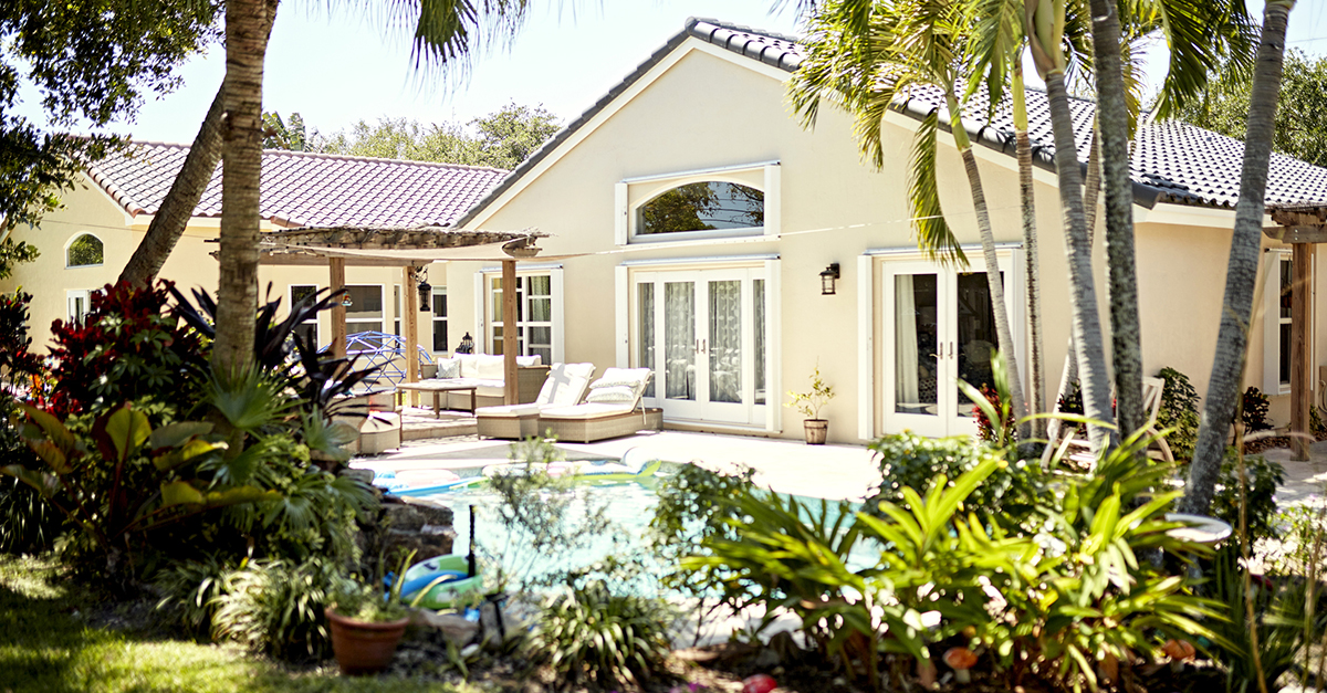 A house with a nice pool and landscaping.